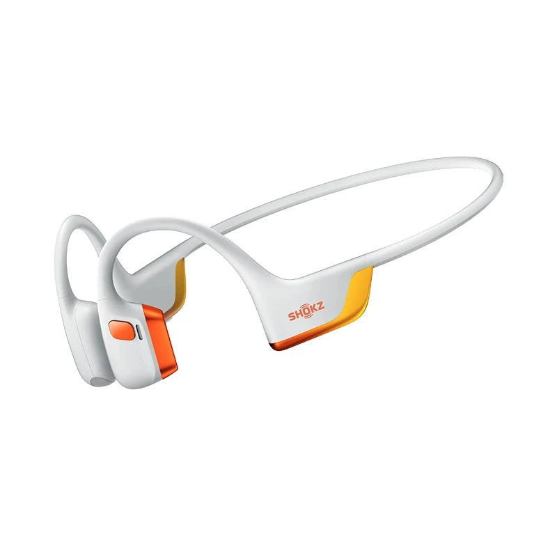 White and orange Shokz bone conduction headphones on a white background