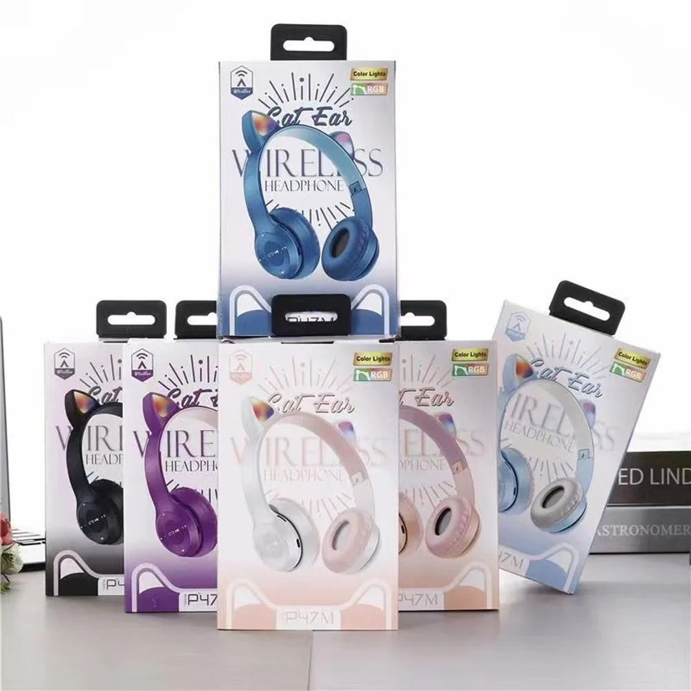 Collection of 'Cat Ear' wireless headphones in various colors with their packaging on a white background.