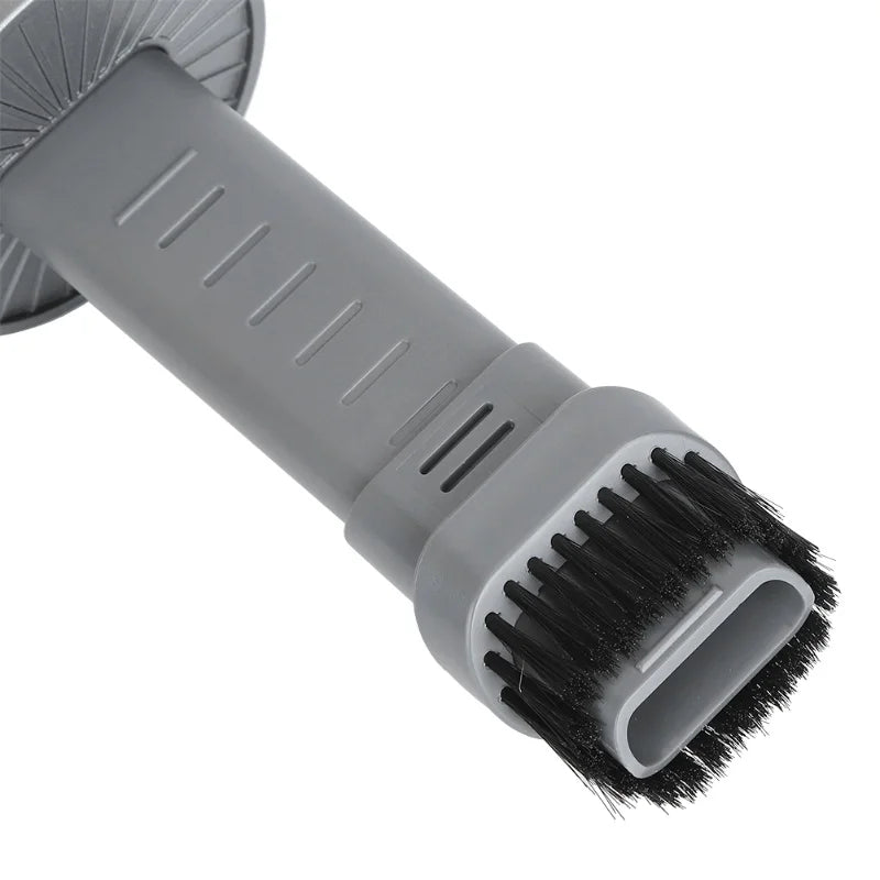 Gray brush with black bristles on a white background