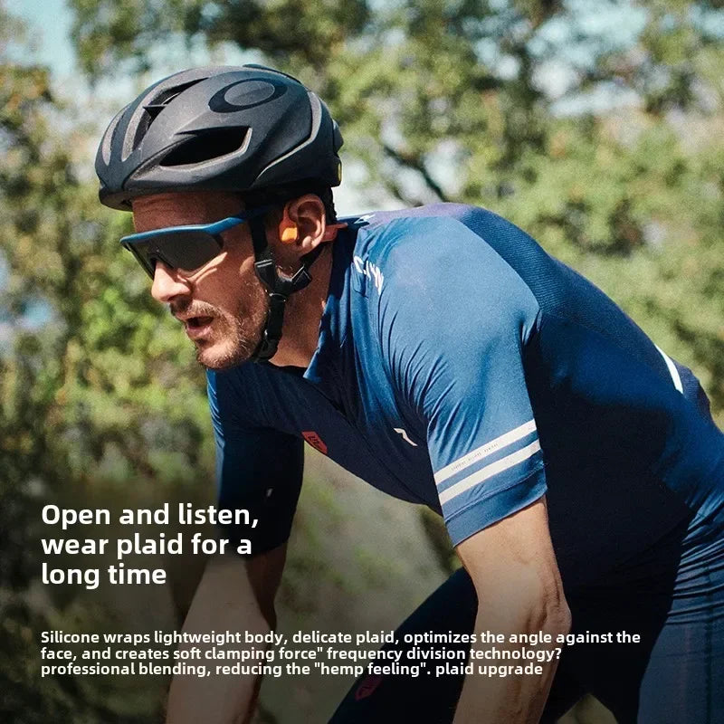 Cyclist wearing a helmet and sunglasses with a blurred natural background