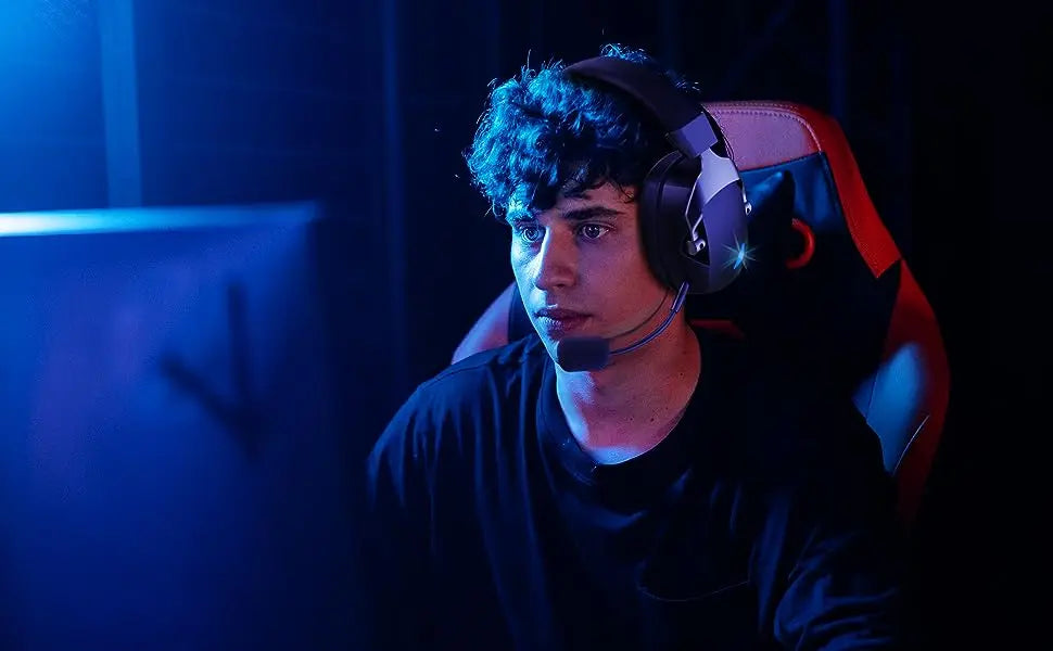 Person wearing a headset in a dark room with blue lighting