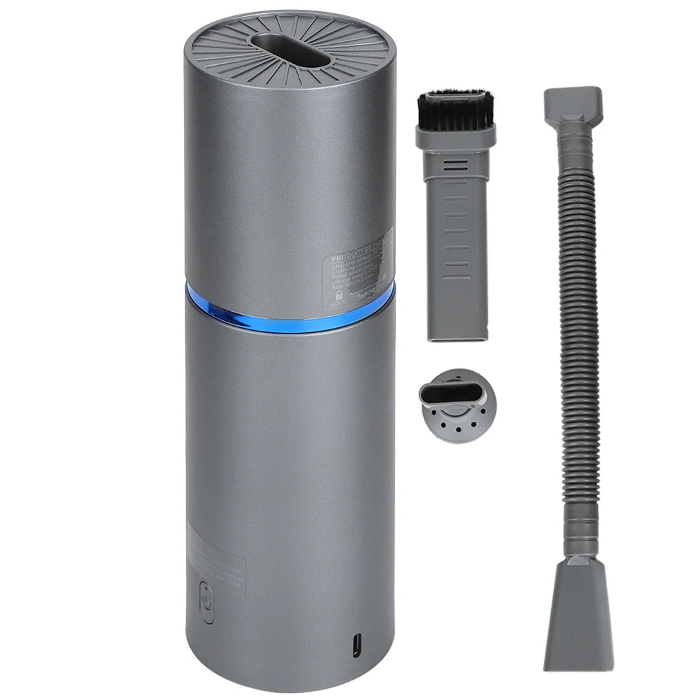 Gray handheld vacuum cleaner with attachments on a white background