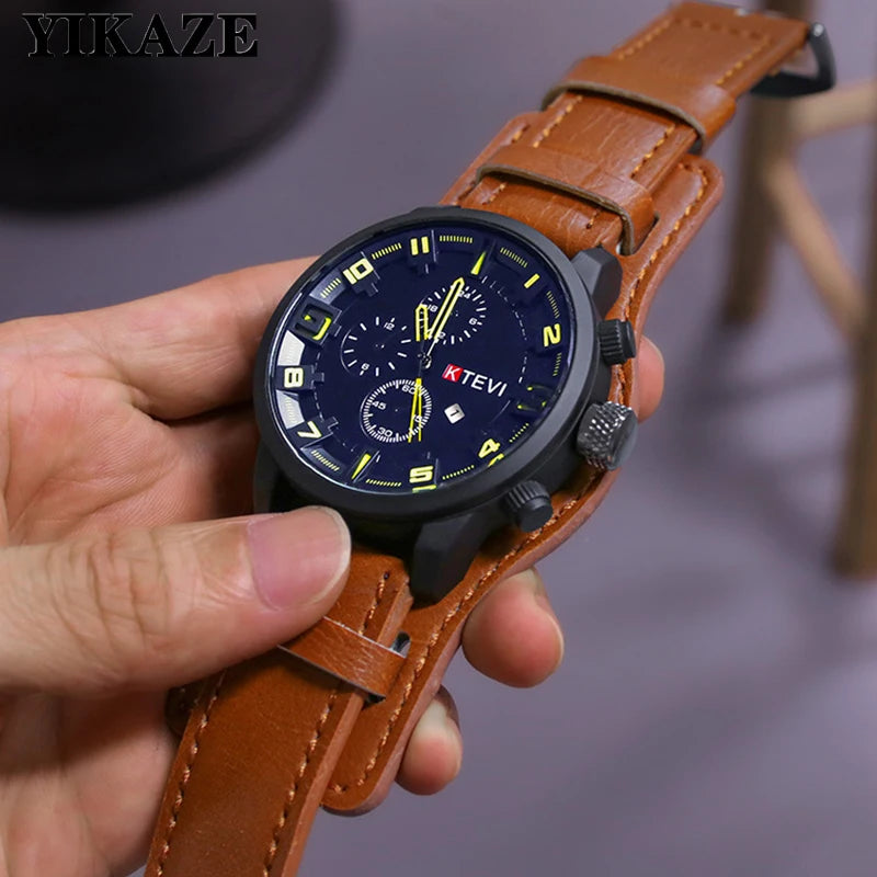 Hand holding a KTEVI watch with a brown leather strap