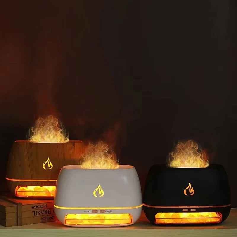 Three flame-shaped humidifiers on a dark background