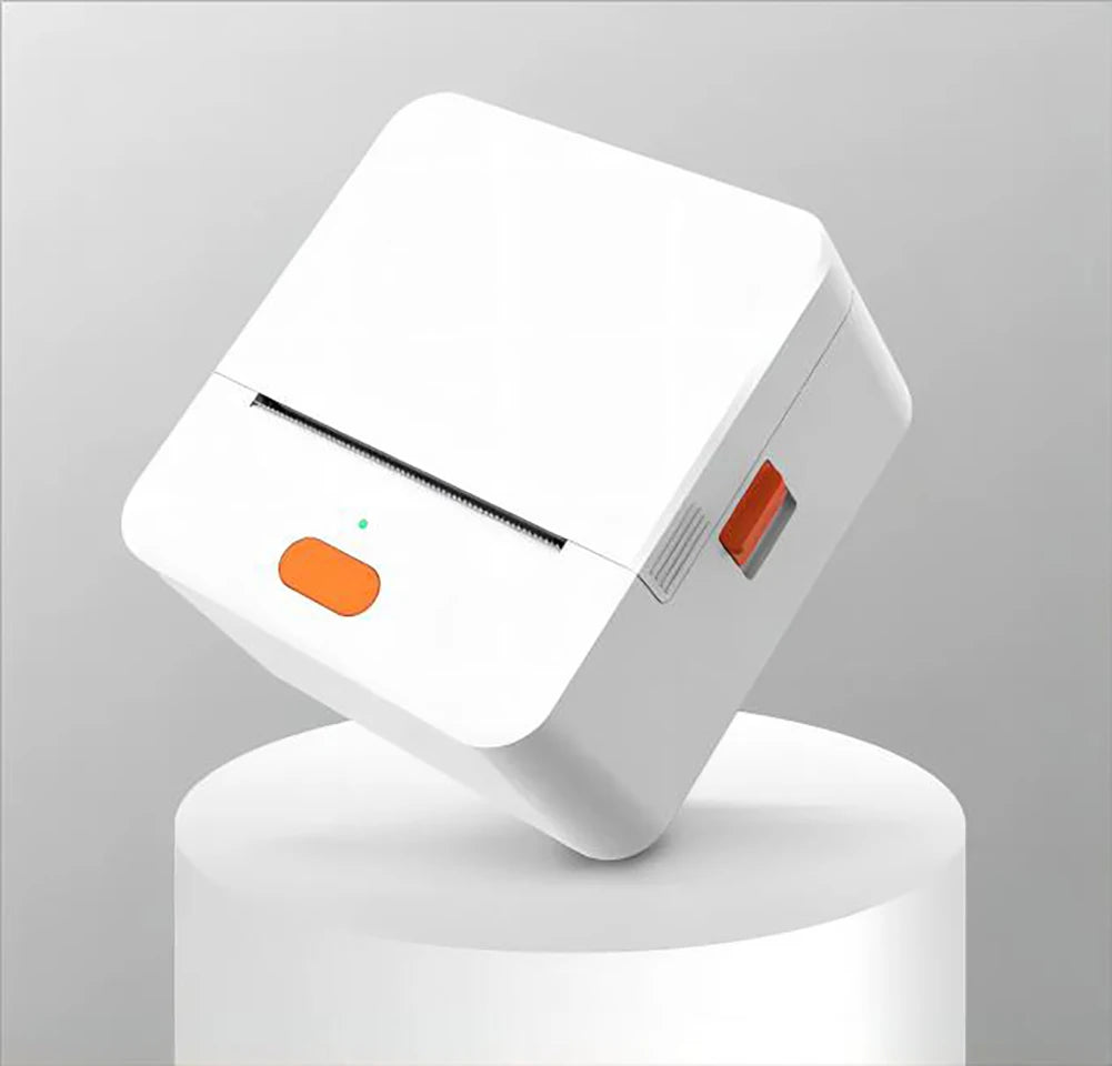 White electronic device with orange button on a gray background