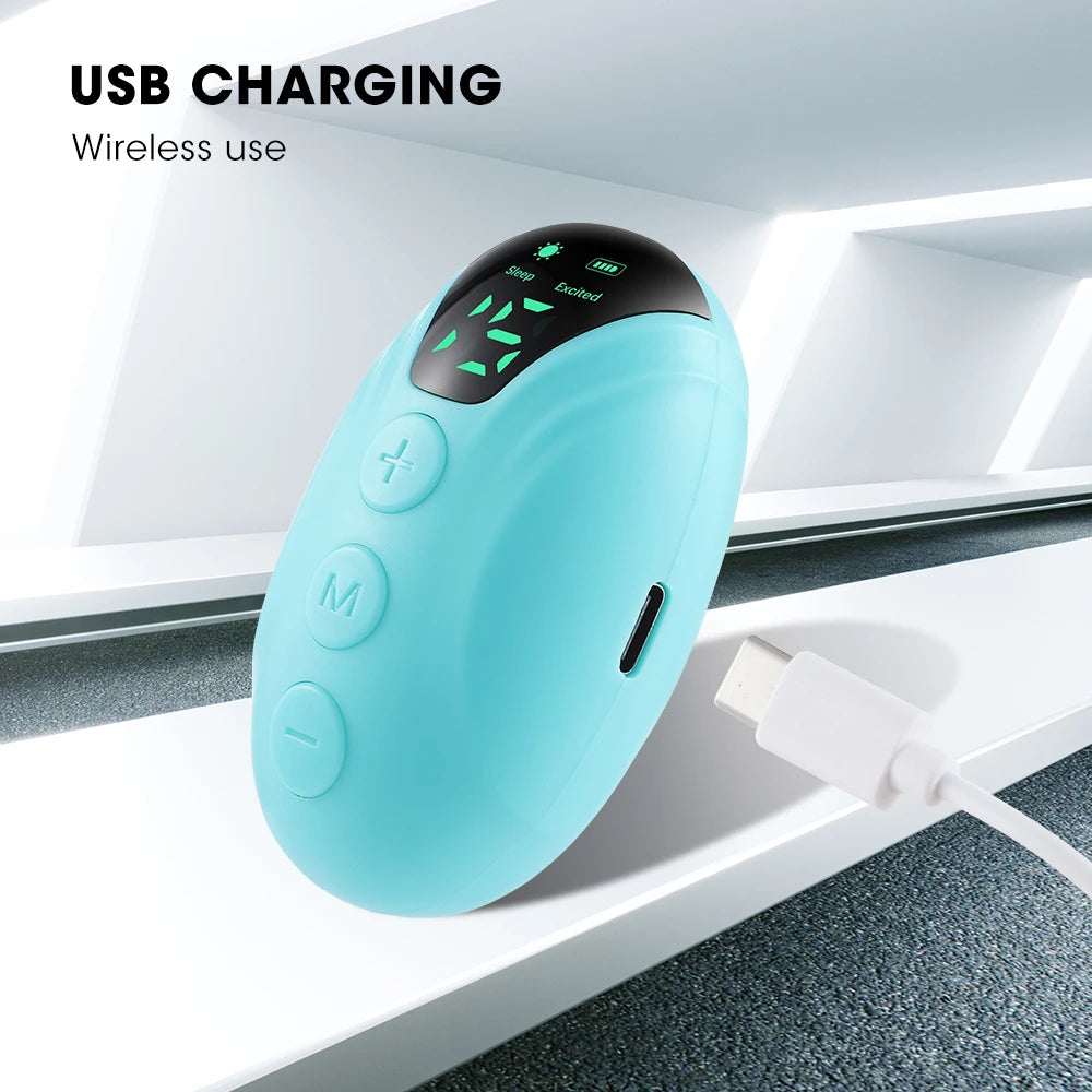 Turquoise electronic device with buttons and a screen on a white background, labeled 'USB Charging' and 'Wireless use'.