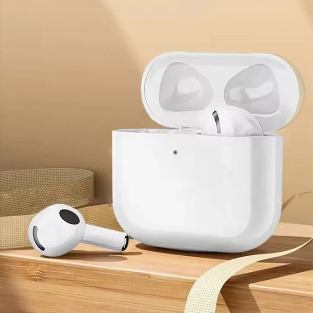 White wireless earbuds with charging case on a wooden surface