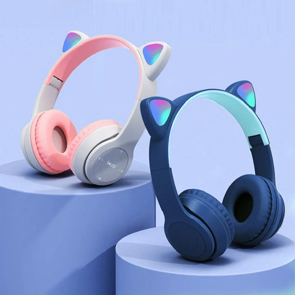 Pair of colorful headphones with cat ear designs on a blue background