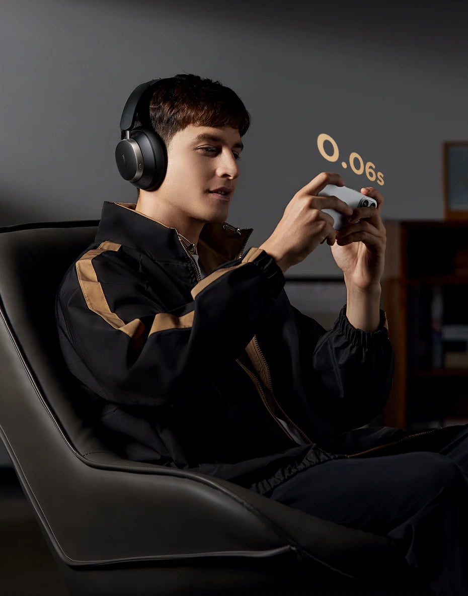Person playing a video game with headphones on, sitting in a dark room.